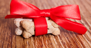 Dog treats we love - picture of a dog treat wrapped in red ribbon